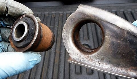 Taking apart rusted bushing component